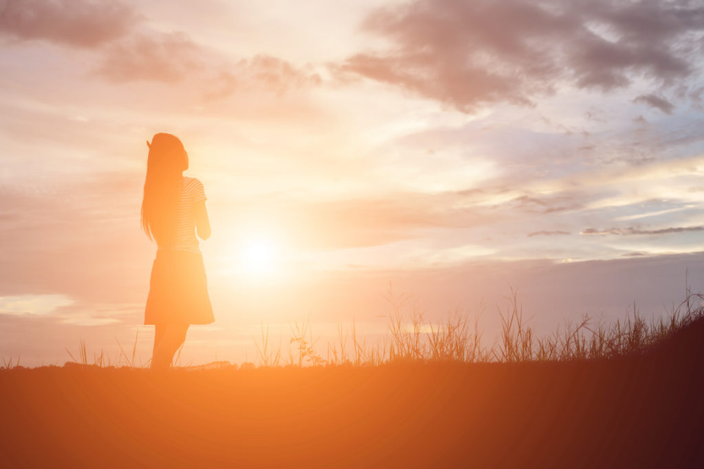 woman praying alone